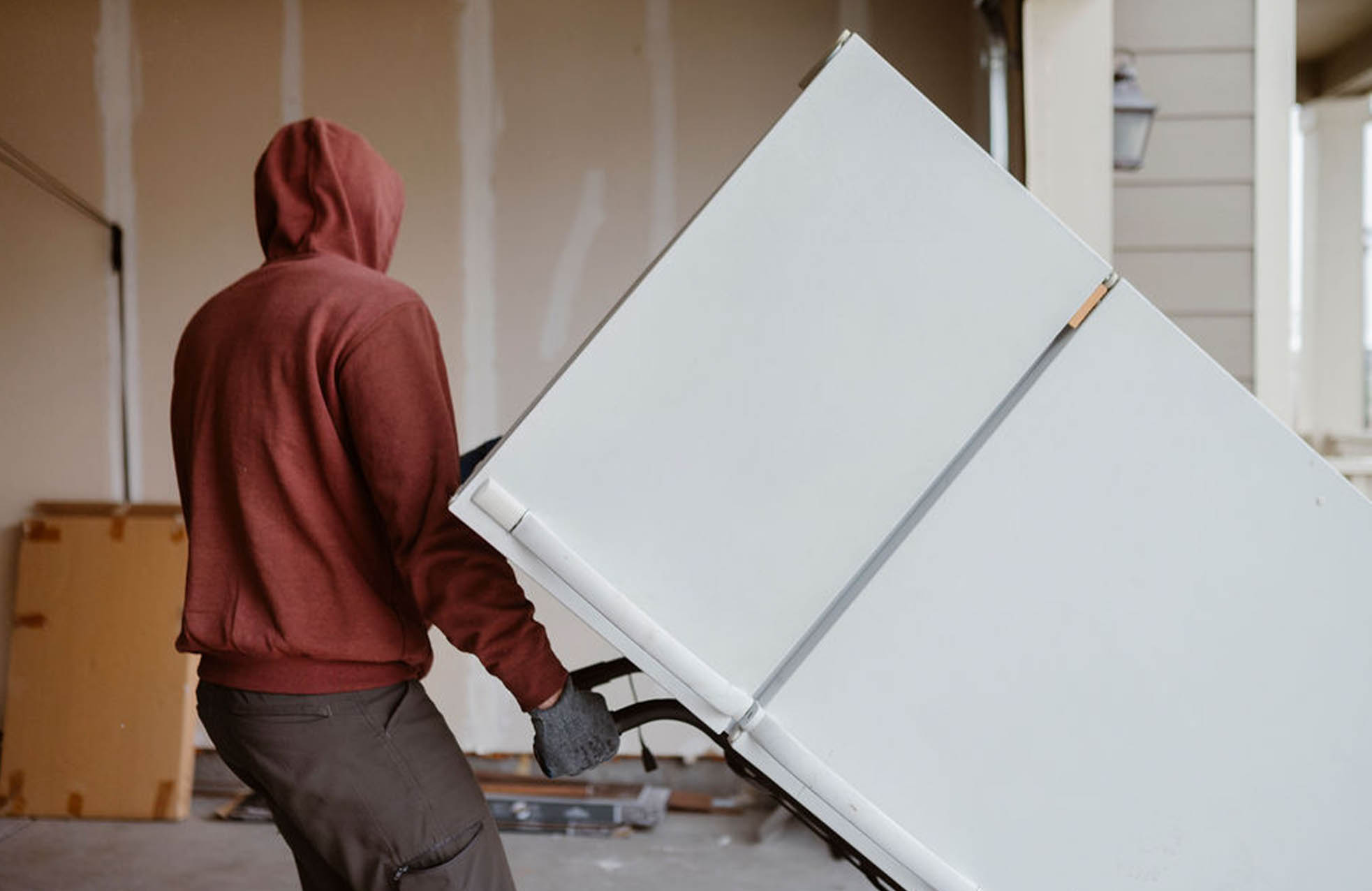 Appliance removal service - professional moving refrigerator