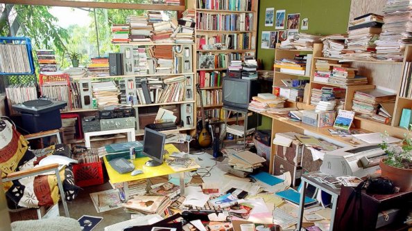 Hoarding cleanup services - cluttered room needing professional help