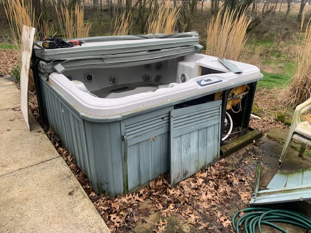 Hot tub and spa removal - old hot tub ready for professional removal